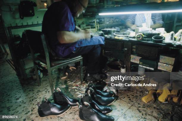 Handmade shoe store Two men make flamenco shoes in the Gallardo handmade shoe store. Madrid