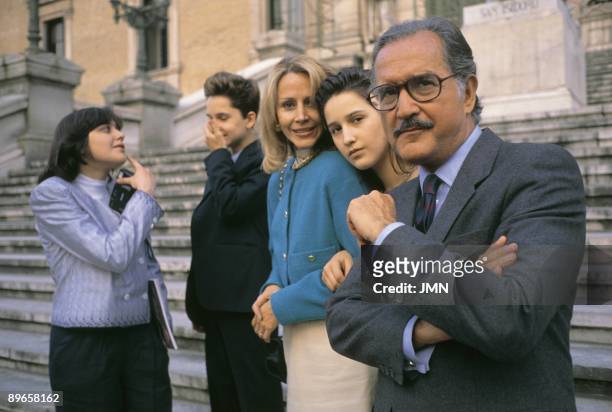 Carlos Fuentes, writer, next to his family in the National Library