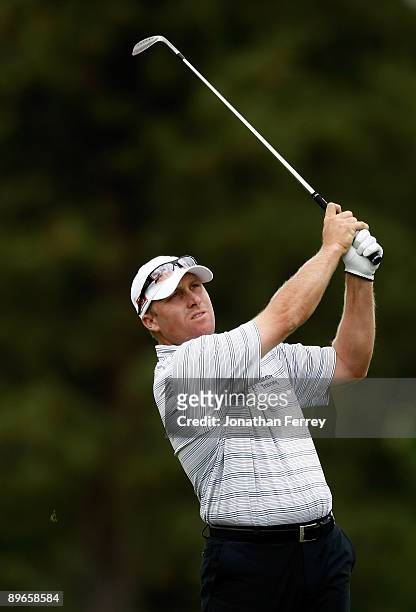 John Rollins hits his second shot on the 18th hole during the second round of the Legends Reno-Tahoe Open on August 7, 2009 at Montreux Golf and...