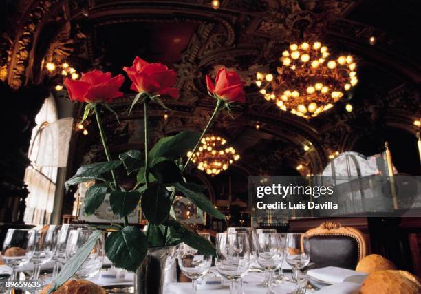 Le Train Bleu restuarant View of the flowers and covered with a table of the living room of the literary restaurant of Le Train Bleu of Paris