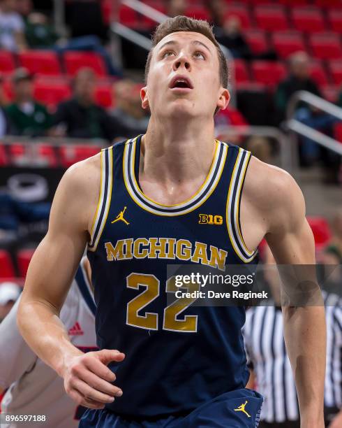 Duncan Robinson of the Michigan Wolverines looks down court against the Detroit Titans during game one of the Hitachi College Basketball Showcase at...