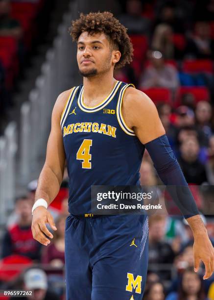 Isaiah Livers of the Michigan Wolverines follows the play against the Detroit Titans during game one of the Hitachi College Basketball Showcase at...