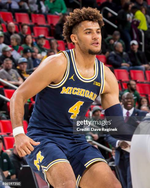 Isaiah Livers of the Michigan Wolverines follows the play against the Detroit Titans during game one of the Hitachi College Basketball Showcase at...