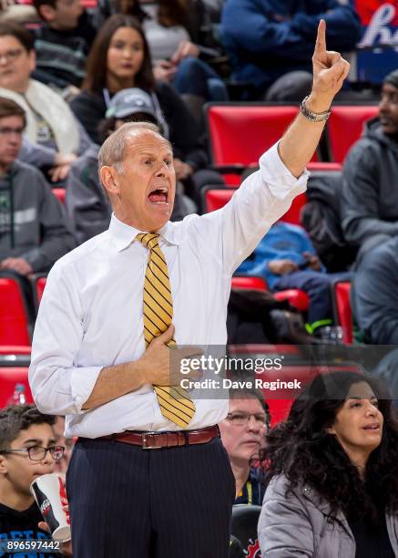 Head coach John Beilein of the Michigan Wolverines watches the play from the sidelines against the Detroit Titans during game one of the Hitachi...