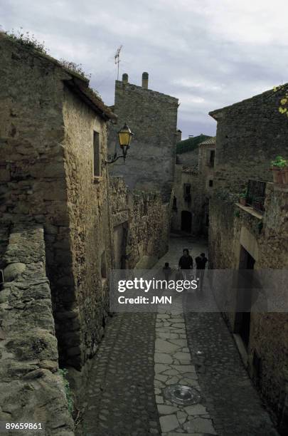 Street of Pals People walks on a typical street of Pals, Gerona province