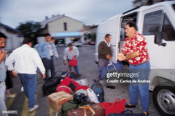 Spanish emigrants in the French vintage Spanish emigrants take up the baggage in a van for travel to vintage to France