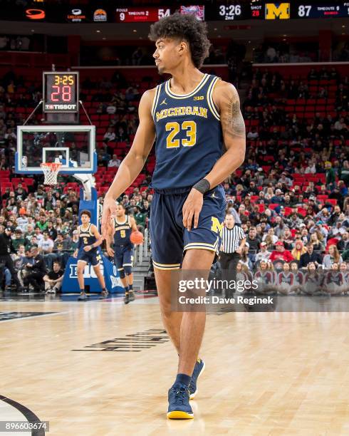 Ibi Watson of the Michigan Wolverines walks up court against the Detroit Titans during game one of the Hitachi College Basketball Showcase at Little...