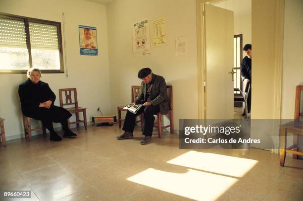 Waiting room in a doctor office Patients sat down in the waitinf room in the doctor officce of a town