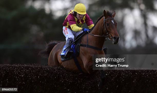 Le Rocher ridden by Tom Scudamore jump the last on their way to winning the 188Bet Graduation Chase at Exeter Racecourse on December 21, 2017 in...