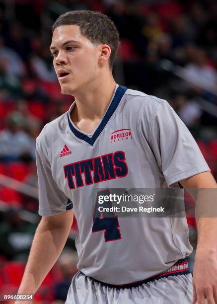 DeShawndre Black of the Detroit Titans runs up court against the Michigan Wolverines during game one of the Hitachi College Basketball Showcase at...