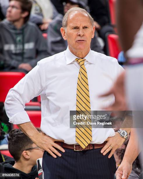 Head coach John Beilein of the Michigan Wolverines watches the play from the sidelines against the Detroit Titans during game one of the Hitachi...