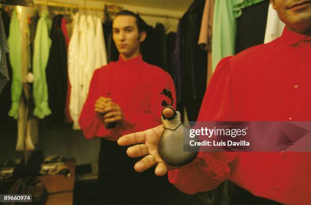 Flamenco dancer with castanets Dressing rooms of the Corral de la Moreria, flamenco stage