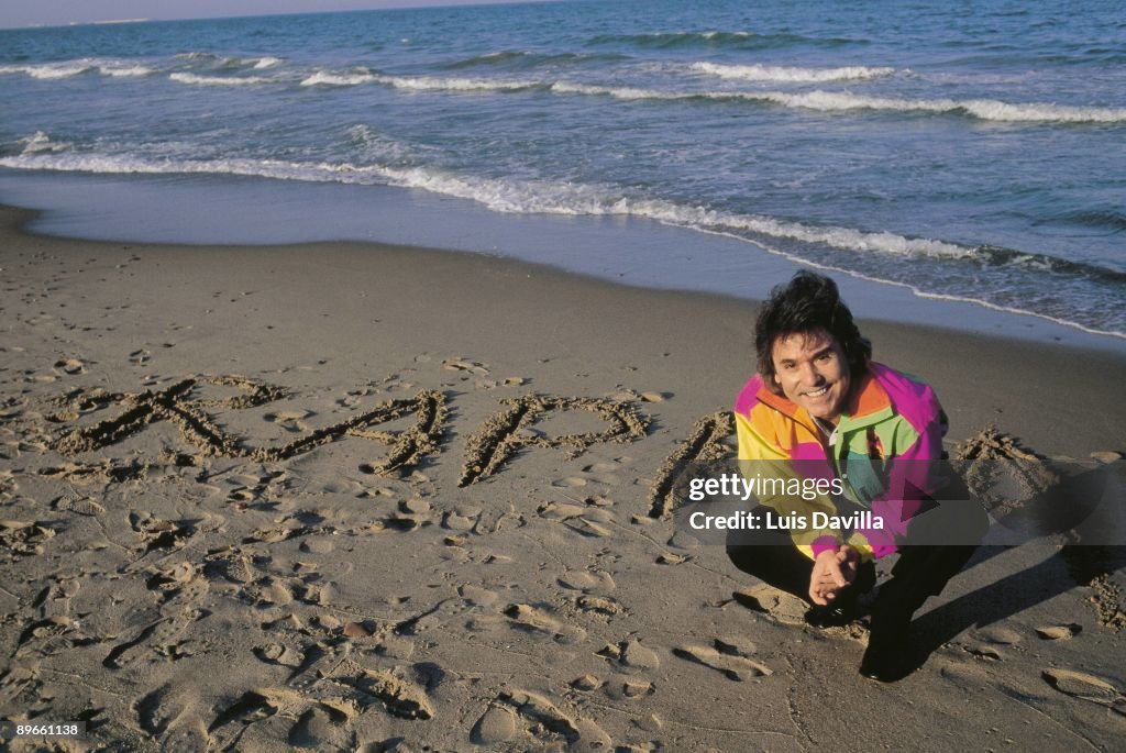 Raphael, singer The singer in the seashore with his name written in the beach