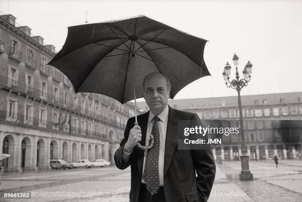 Francisco Fernandez Ordonez, minister of Foreign Affairs The PSOE politician under an umbrella in the Mayor Square of Madrid