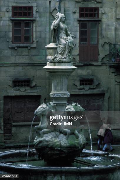 Fountain of a square in Santiago of Compostela View of a source in a square of the old area of Santiago de Compostela, La Coruna province