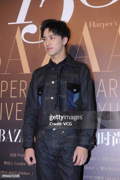 Actor Xu Weizhou attends the opening ceremony of Harper's Bazaar 150th Anniversary Exhibition on December 21, 2017 in Shanghai, China.