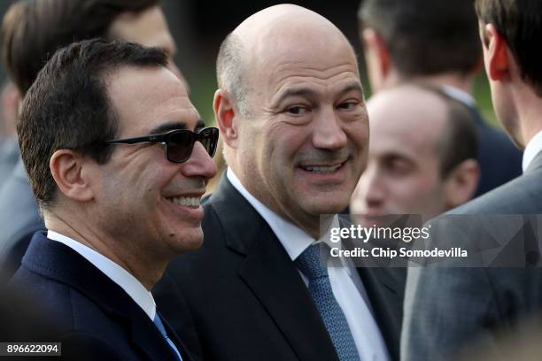 Treasury Secretary Steve Mnuchin and White House National Economic Council Director Gary Cohn attend an event to celebrate Congress passing the Tax...