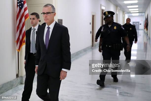 Federal Bureau of Investigation Deputy Director Andrew McCabe is escorted by U.S. Capitol Police before a meeting with members of the Oversight and...