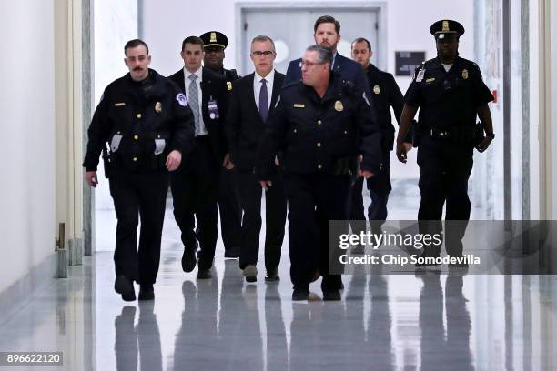 Federal Bureau of Investigation Deputy Director Andrew McCabe is escorted by U.S. Capitol Police before a meeting with members of the Oversight and...