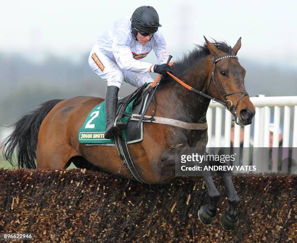 Finians Rainbow ridden by Barry Geraghty clears the last fence to win during the Melling Steeple Chase on the second day of the Grand National horse...