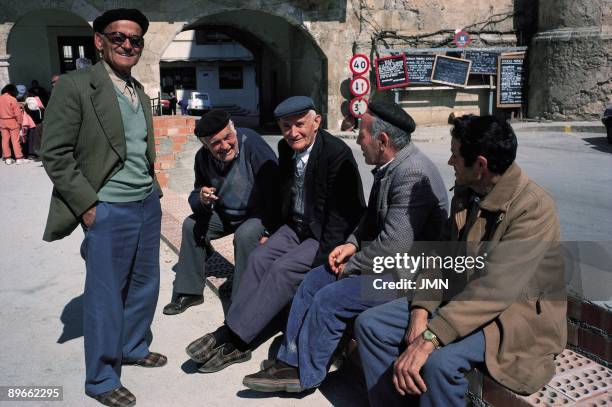 Tarazona de la Mancha. Albacete A group of old men speaks sat down in one of the streets of the town