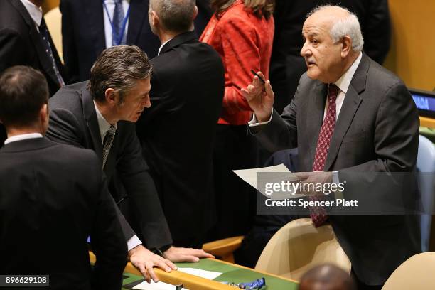 Ambassador Riyad Mansour, Permanent Observer Mission of Palestine to the United Nations, speaks to other diplomats on the floor of the General...