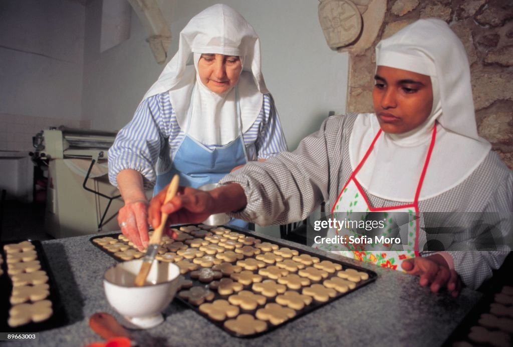 Monastery Cook Nuns making cookies Two nuns cook cookies in Santa Clara´s Monastery ...
