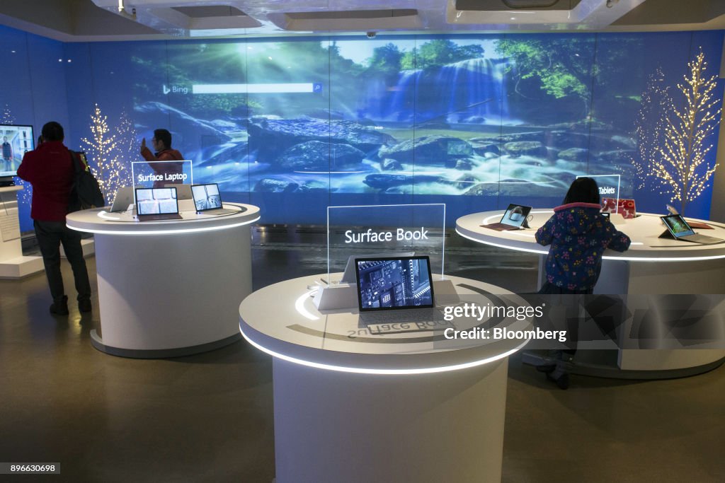 Products sit on display at a visitor center of the Microsoft Corp ...
