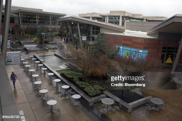 Person walks through the Microsoft Corp. Main campus in Redmond, Washington, U.S., on Tuesday, Dec. 19, 2017. In the race to commercialize a new type...