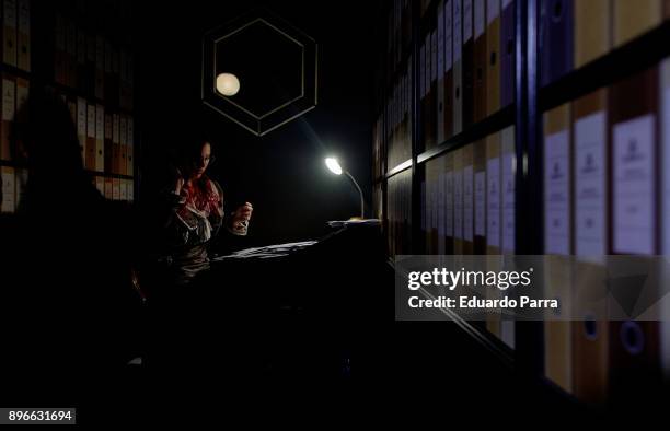 An actor performs the 'Departamento de envios extraordinarios' Christmas event presentation at Nuevos Ministerios train station on December 21, 2017...