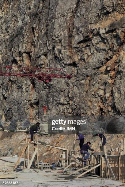 Santona. Cantabria ´Marsh of Santona´ Urban growth: workers working in a building in construction