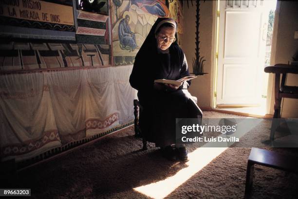 Nun reading A nun reads a book in a room of the Convent of La Natividad