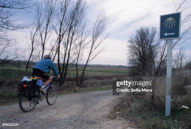 On the way to Santiago A man travels the one on the way to Santiago on bicycle. Lion county