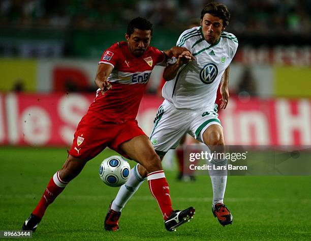 Andrea Barzagli of Wolfsburg and Elson of Stuttgart battle for the ball during the Bundesliga match between VfL Wolfsburg and VfB Stuttgart at...