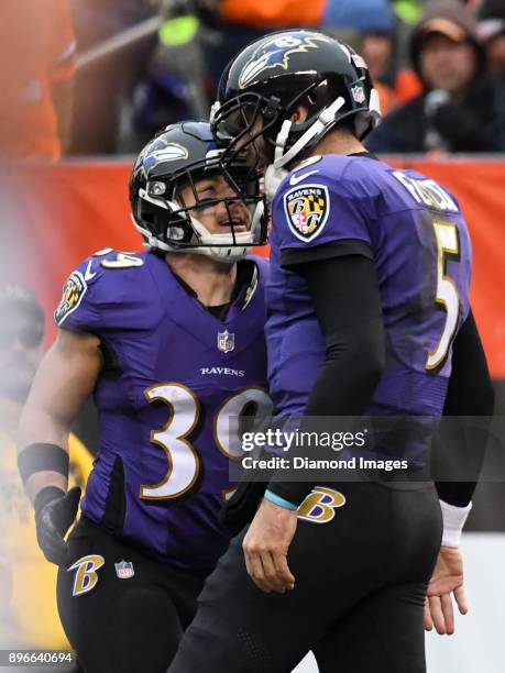 Quarterback Joe Flacco and running back Danny Woodhead of the Baltimore Ravens celebrate after a rushing touchdown by Flacco in the second quarter of...