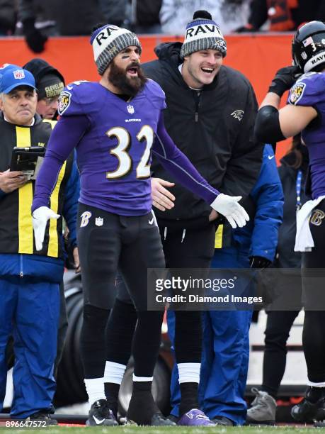 Safety Eric Weddle and quarterback Ryan Mallett of the Baltimore Ravens greet players on the sideline after a touchdown drive in the second quarter...