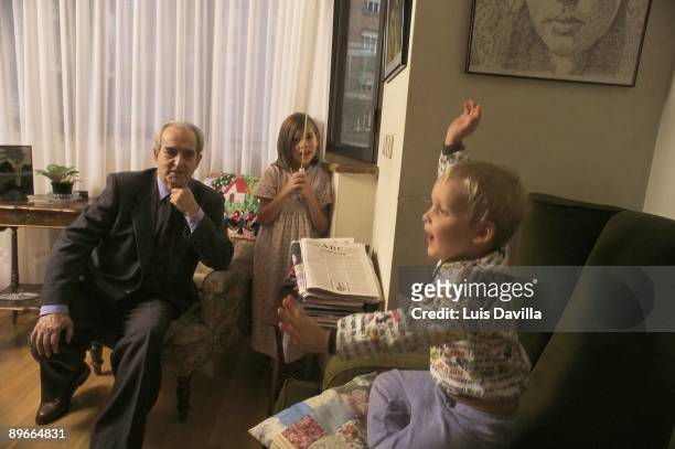 The socialist politician Fernando Moran, in his house, next to his grandsons