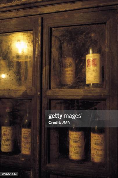 Bottles of wine Bottles of wine inside a piece of furniture in Bodegas de Ismael Arroyo company, Burgos province