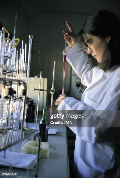 Laboratory of wine A woman works in the laboratory of wine of the Bodegas Protos in Penafiel. Valladolid province