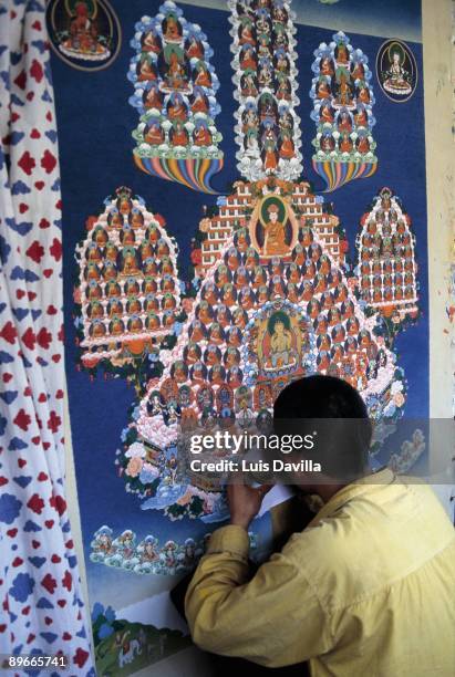 Buddhist mural A man paints a Buddhist mural in the temple and residence of the Dalai Lama in Dharamsala