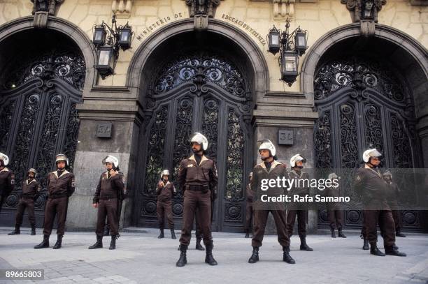 National policemen in front of the Ministry of Education and Science National policemen in front of the entrance of the Ministry of Education and...