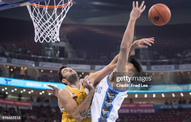 Ioannis Bourousis of Guang Sha and Justin Hamilton of Beijing Ducks in action during the 2017/2018 CBA League match between Beijing Duck and Guang...