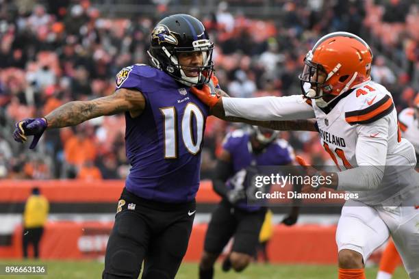 Wide receiver Chris Moore of the Baltimore Ravens engages cornerback Mike Jordan of the Cleveland Browns on punt coverage in the third quarter of a...