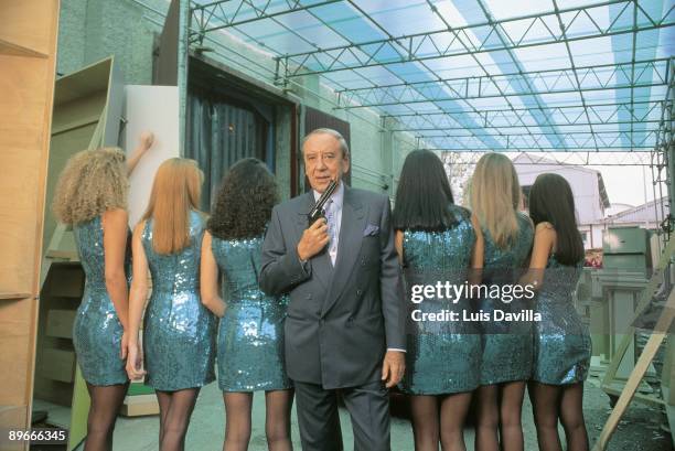 Joaquin Prat, television presenter Joaquin Prat as James Bomd next to a group of young stewardesses of the television program ´The Right Price´