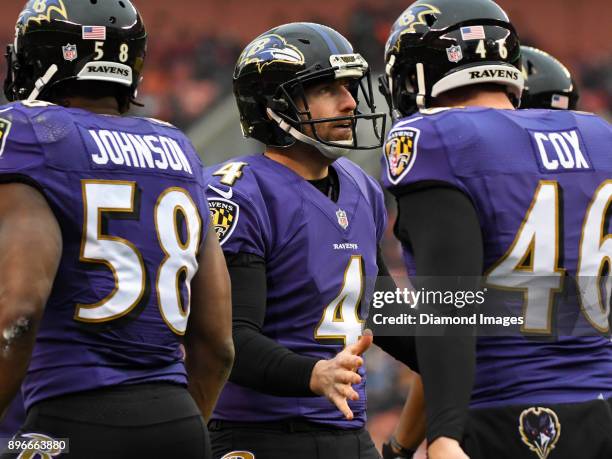 Punter Sam Koch of the Baltimore Ravens greets members of the punt team after downing a punt at the one yard line in the third quarter of a game on...