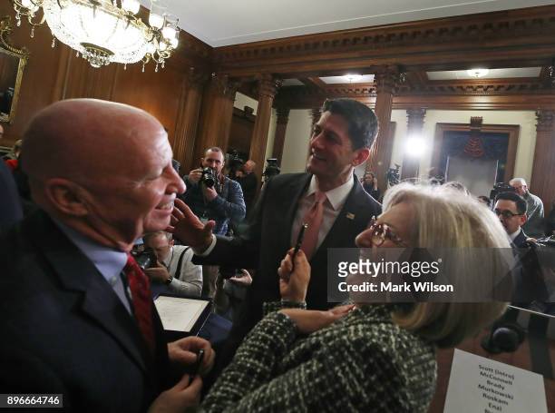 House Speaker Paul Ryan , House Ways and Means Chairman Rep. Kevin Brady and House Budget Committee Chairman Diane Black celebrate after the signing...