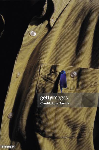 Blue knot A man takes a you shirt a blue knot, symbol against the terrorism during a demonstration in the Basque Country