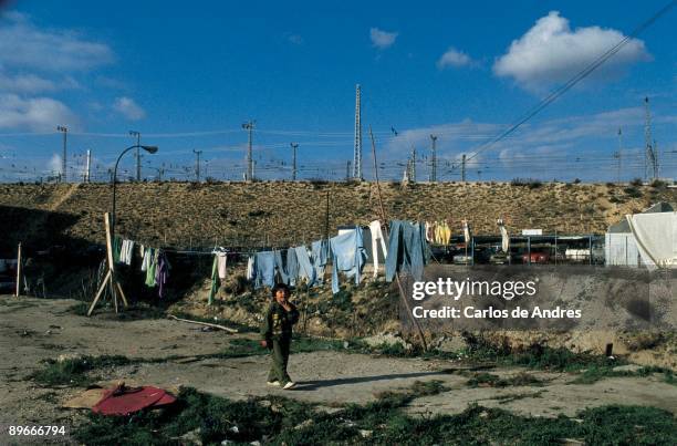 Gipsy boy in a open space Gipsy boy walks for an open space near the shanties