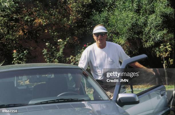 King Juan Carlos I in Palma of Mallorca The King of Spain getting into his car in summer costumes