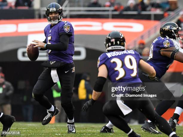 Quarterback Joe Flacco of the Baltimore Ravens throws a pass to running back Danny Woodhead in the third quarter of a game on December 17, 2017...